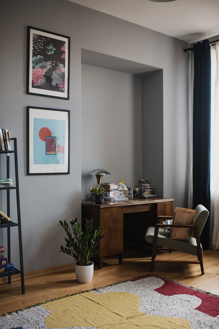why-choose-us Cozy home office with vintage desk, artwork, and natural light ambiance.